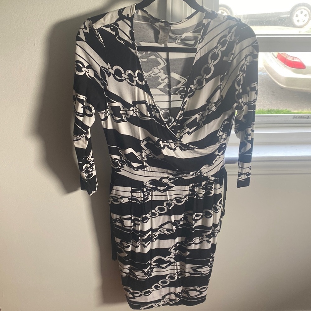 black and white low neck patterned dress with belt